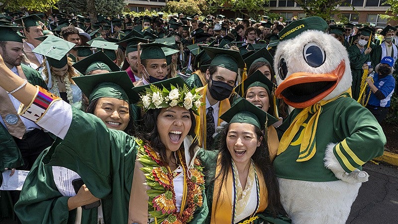 student celebrate commencement with the Duck